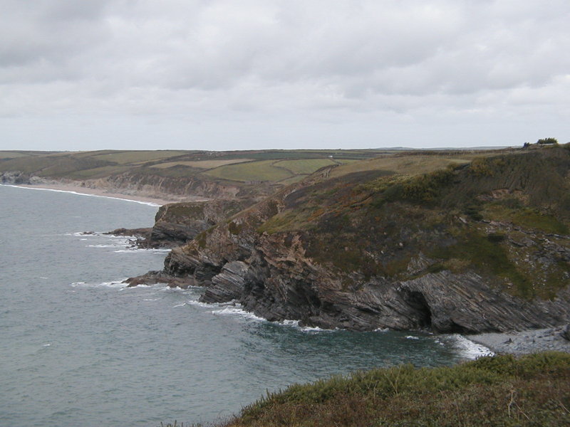 Looking down on series of small headlands, with distinct strata in the rock.