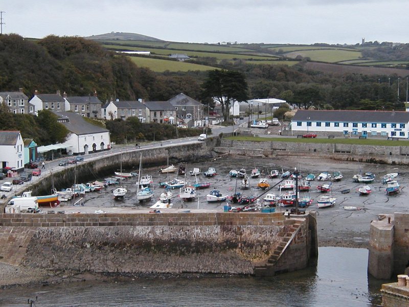 Harbour at low tide, lots of small boats resting on the sand